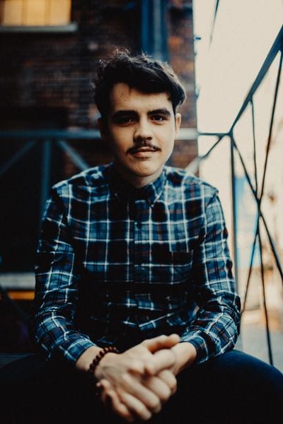 Head shot of David Rabinovitch on a staircase