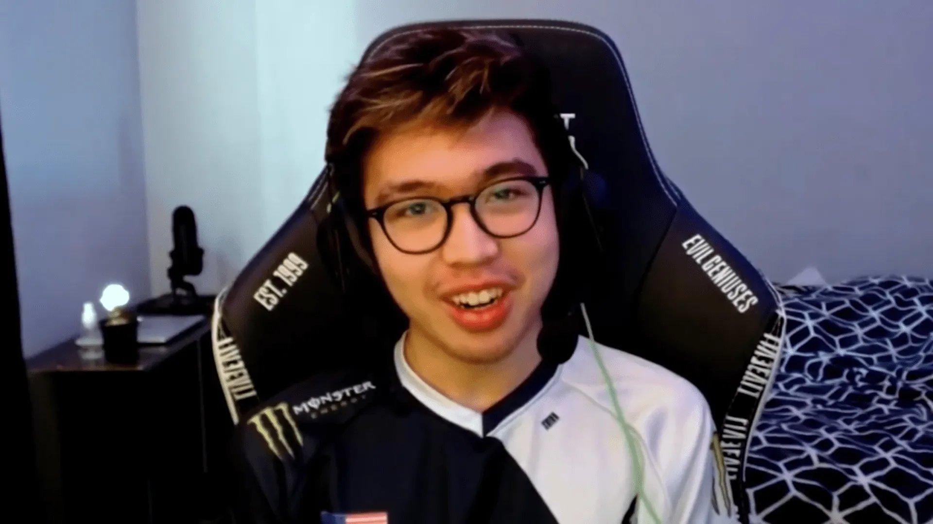 New Evil Geniuses bot laner Danny in his EG jersey and gamer chair