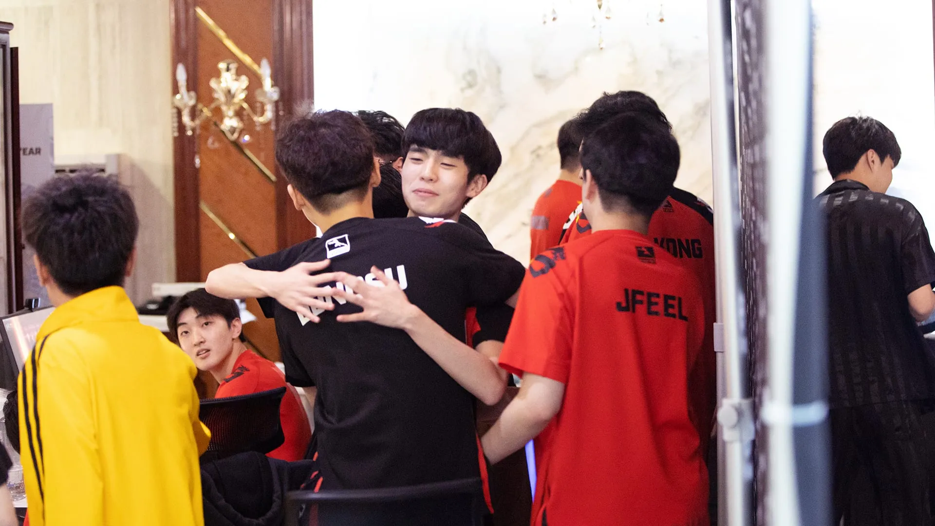 Shanghai Dragons hugging after thier Overwatch win in the June Joust