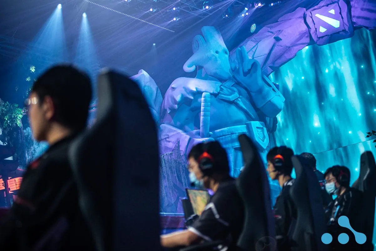players play infront of the Juggernaut stague