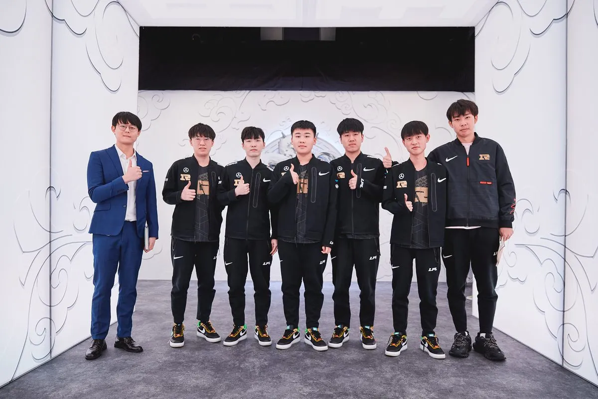 Royal Never Give Up poses after a victory match at the 2021 League of Legends World Championship Groups Stage