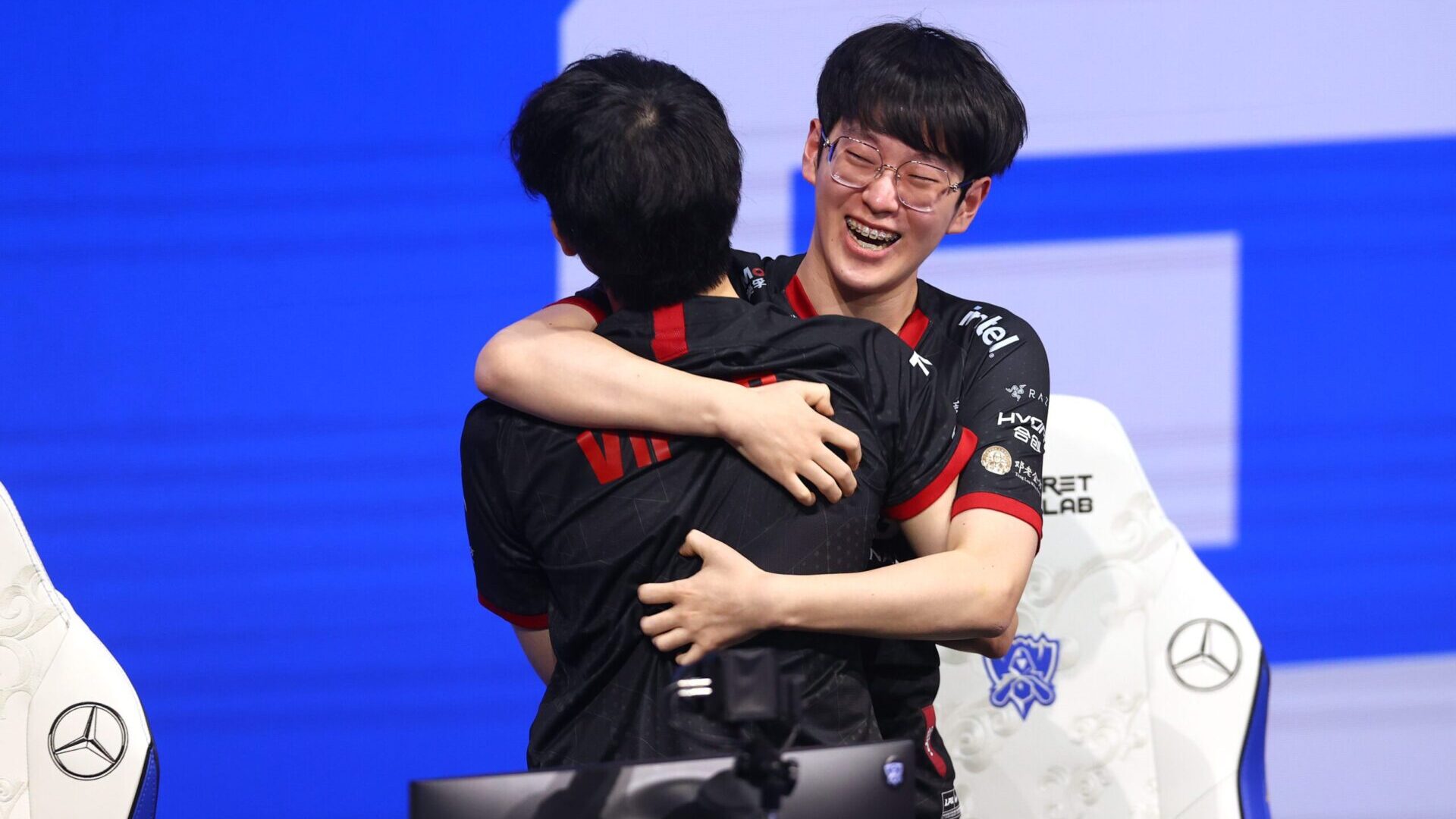 Edward Gaming's Lee "Scout" Ye-chan reacts with teammates onstage after winning the League of Legends World Championship final on Saturday in Reykjavik, Iceland.