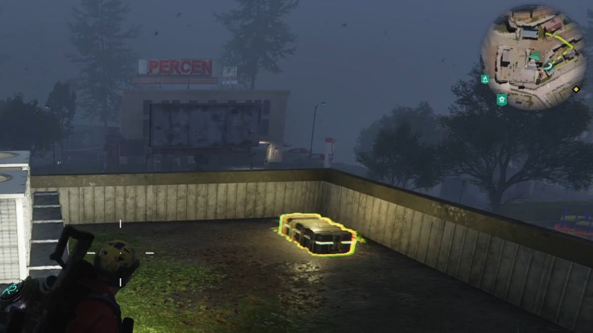 A weapons crate on the roof of a building near the street at Alkirk in Once Human.