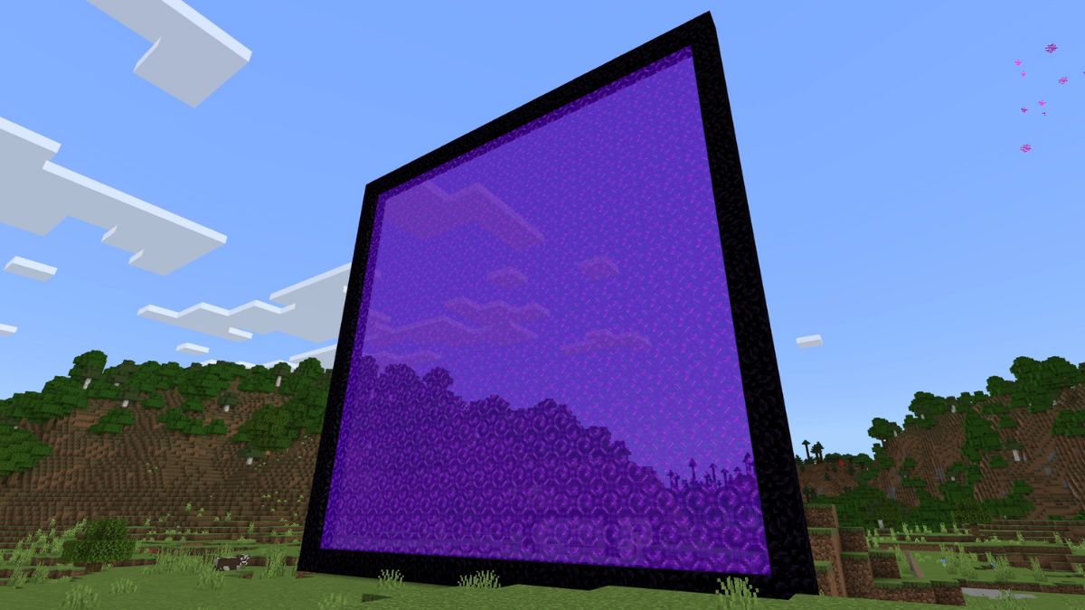 The biggest functional portal players can build in Minecraft stretching up beyond the horizon with a nearby cow for size reference.