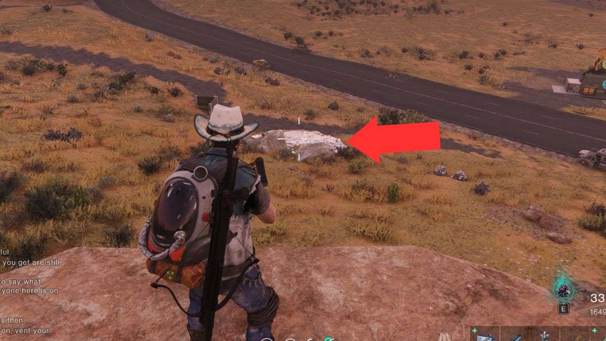 The spawn location of the Prime War boss - a silver puddle on the ground - highlighted by an arrow.