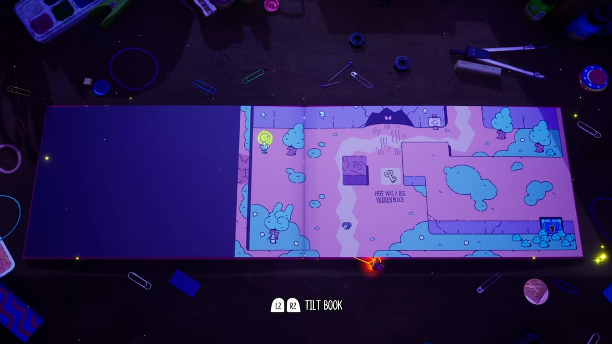 A wide view of the book-like puzzle layout featuring a wooden block obstacle and hidden enemies in a storybook setting.
